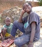 two boys playing a board-game